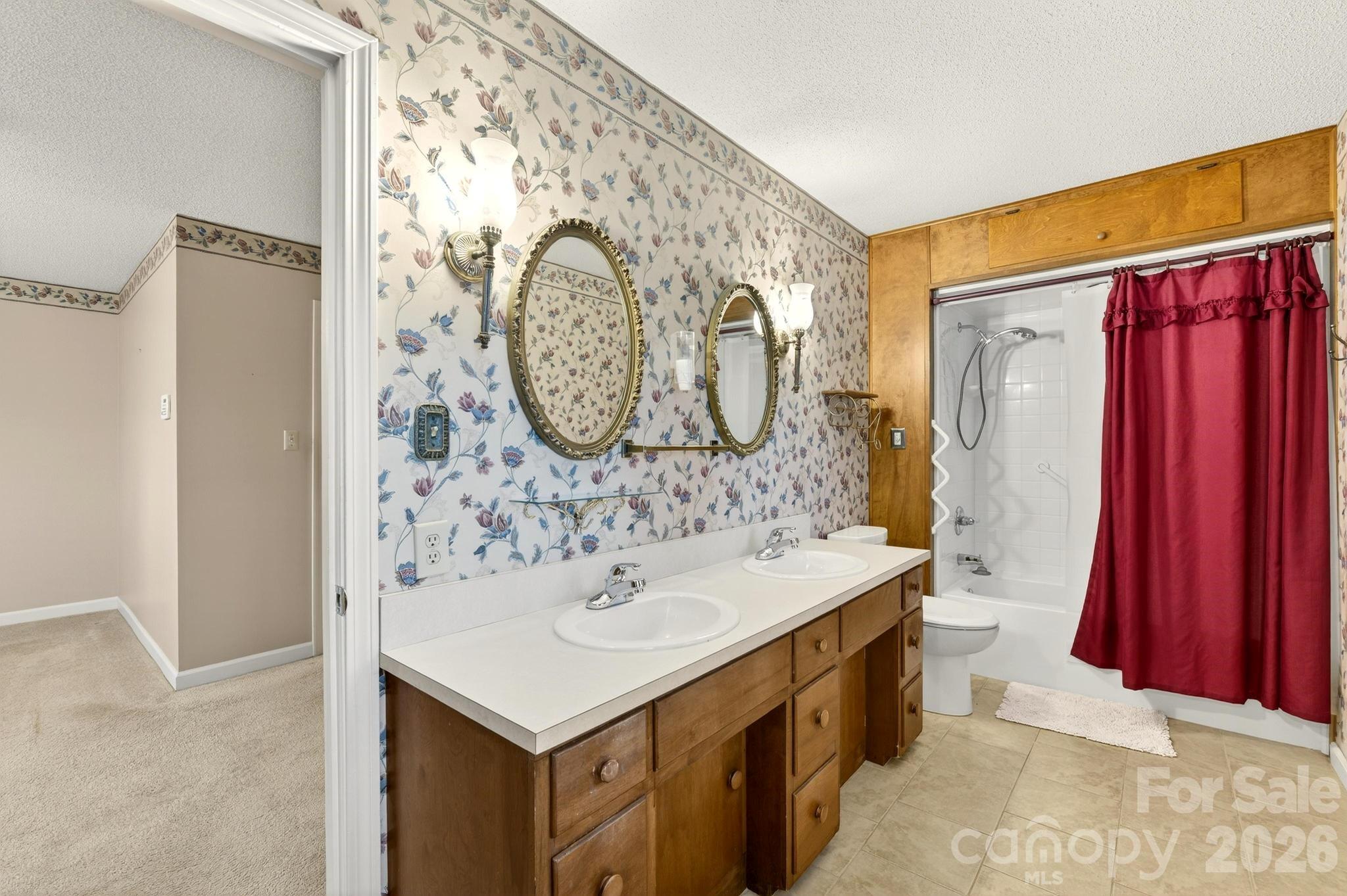 408 Spring Street Northwest Lenoir, NC 28645 - Photo 27 of 47 a bathroom with a sink and a mirror