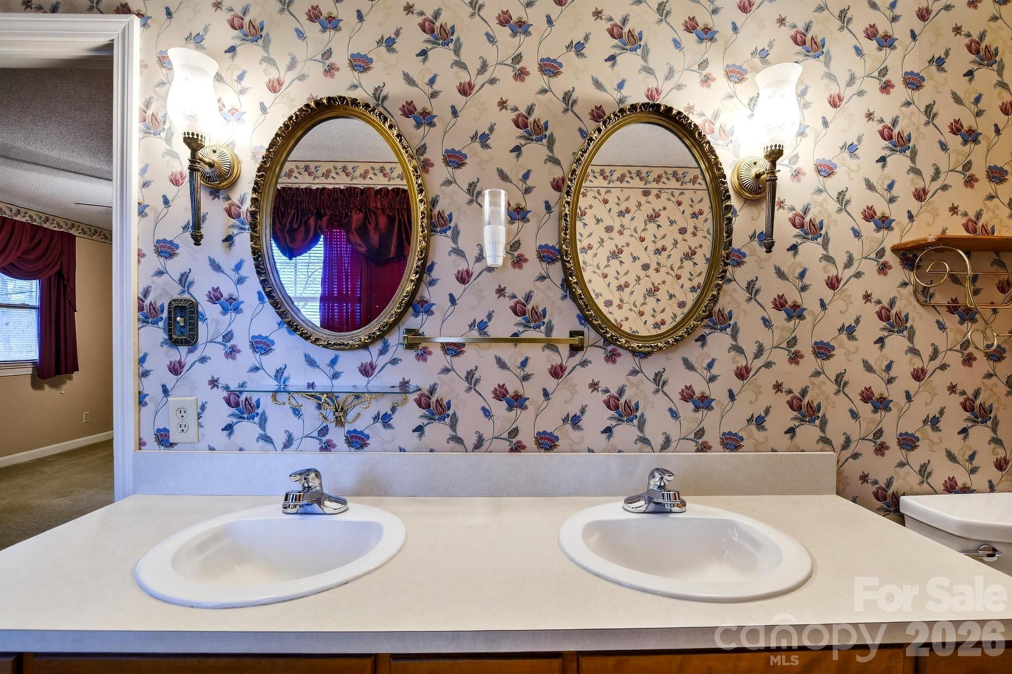 408 Spring Street Northwest Lenoir, NC 28645 - Photo 28 of 47 a bathroom with a sink and a mirror