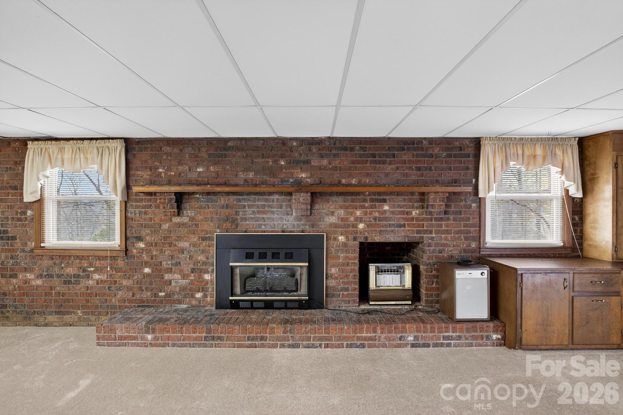 408 Spring Street Northwest Lenoir, NC 28645 - Photo 39 of 47 a living room with a fireplace
