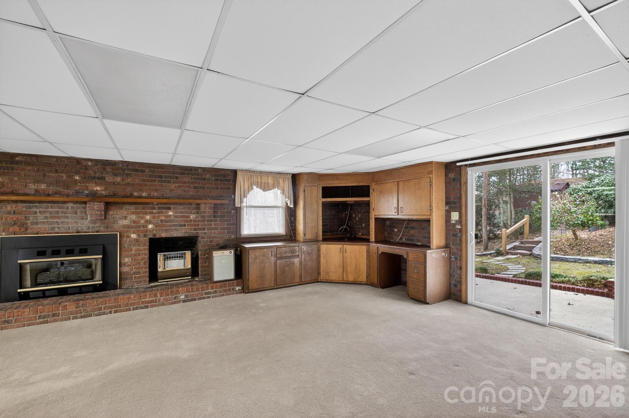 408 Spring Street Northwest Lenoir, NC 28645 - Photo 40 of 47 a large room with stainless steel appliances wooden cabinet and a large window