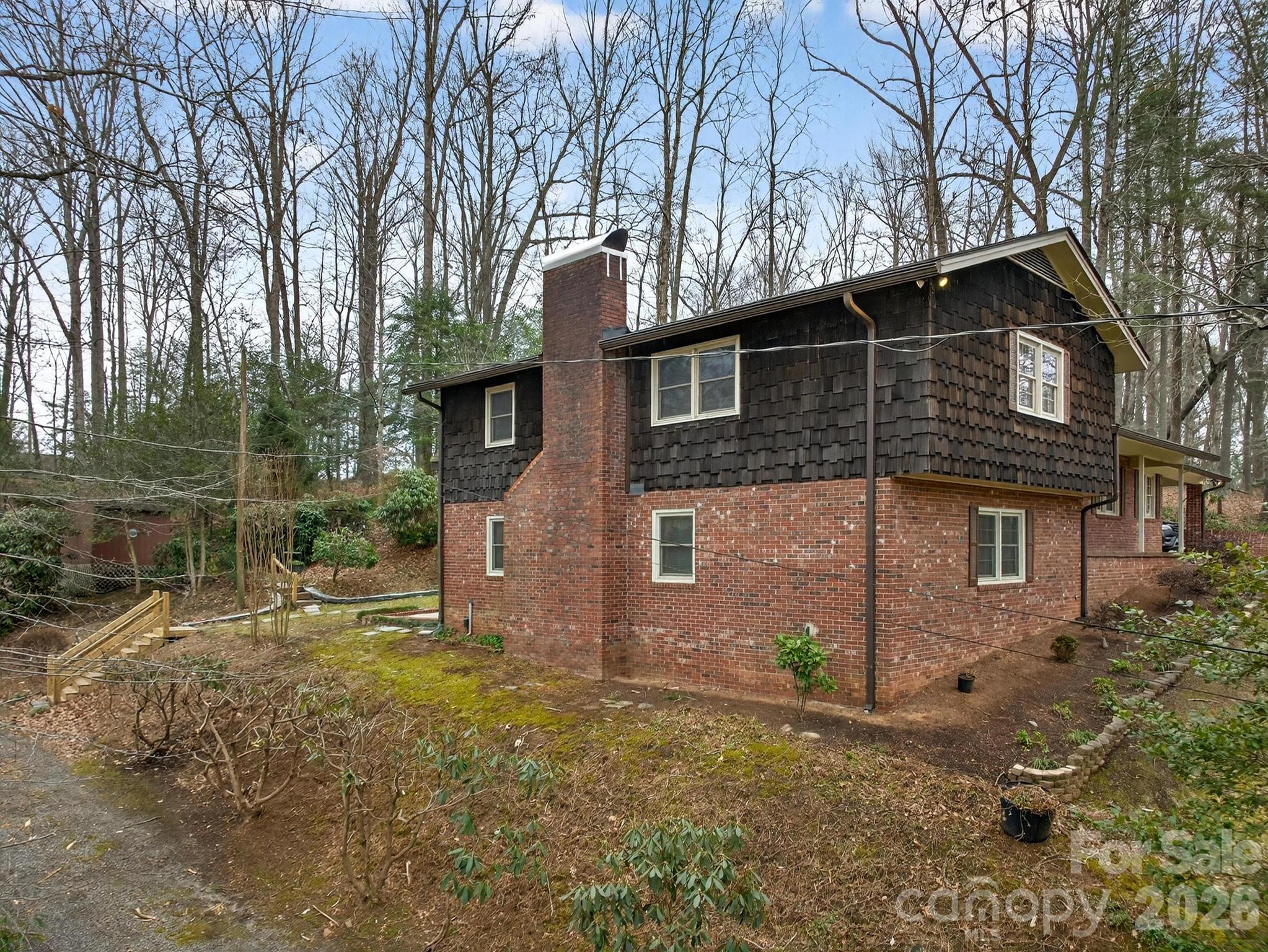 408 Spring Street Northwest Lenoir, NC 28645 - Photo 5 of 47 a backyard of a house with lots of green space