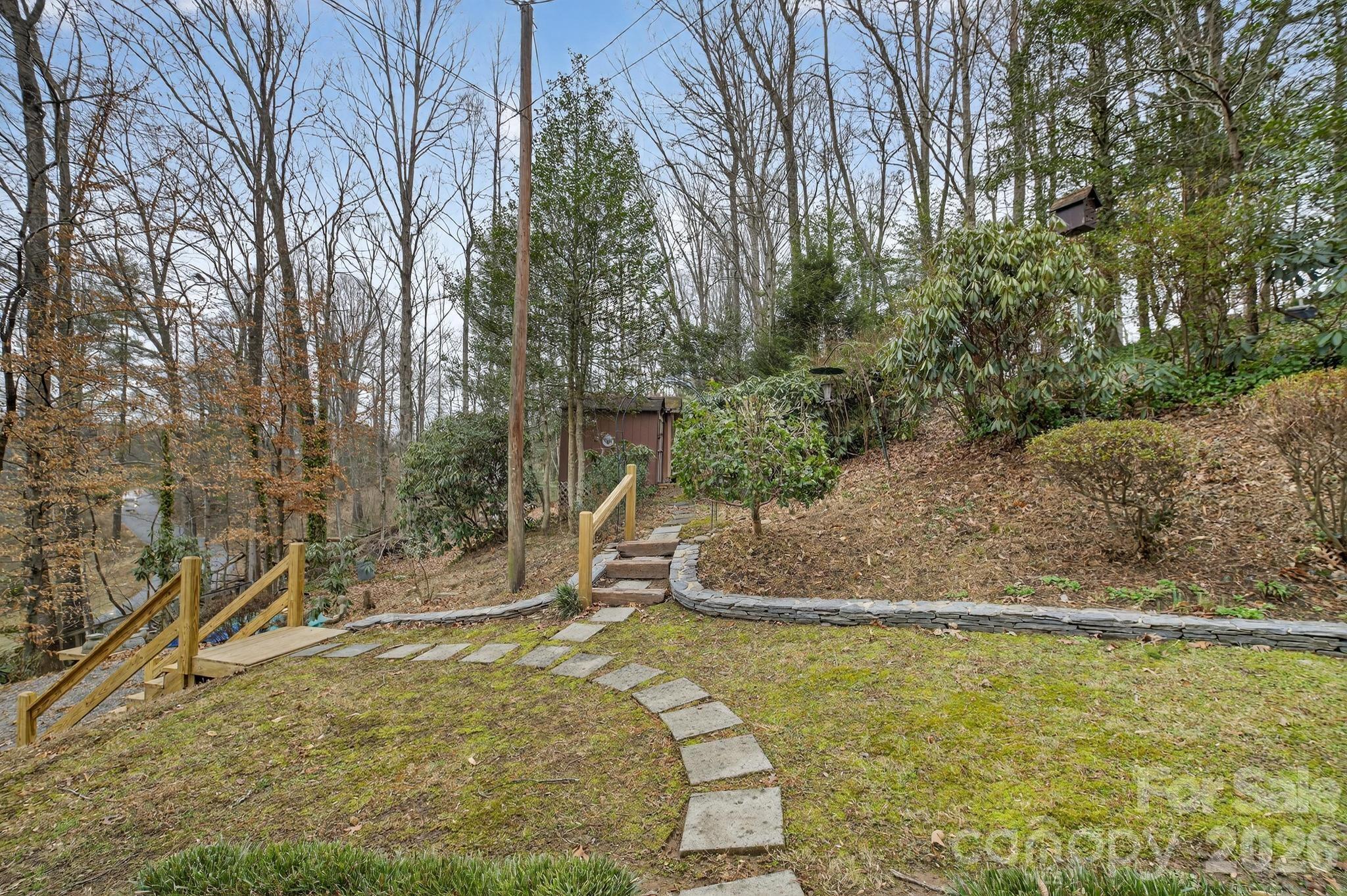 408 Spring Street Northwest Lenoir, NC 28645 - Photo 9 of 47 a view of a yard with large trees