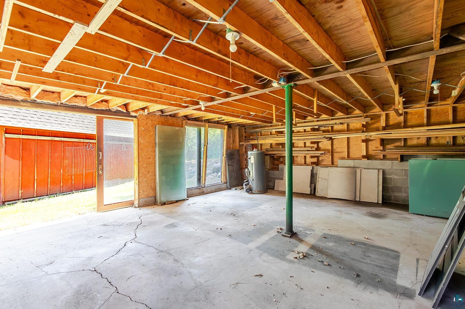 29 Ridge Road Esko, MN 55733 - Photo 40 of 41 Garage space featuring exposed wood joists and concrete flooring