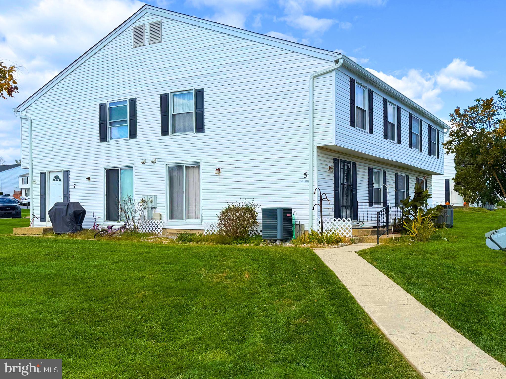 5 Coliston Road, Unit C Reisterstown, MD 21136 - Photo 1 of 39 a front view of a house with a garden