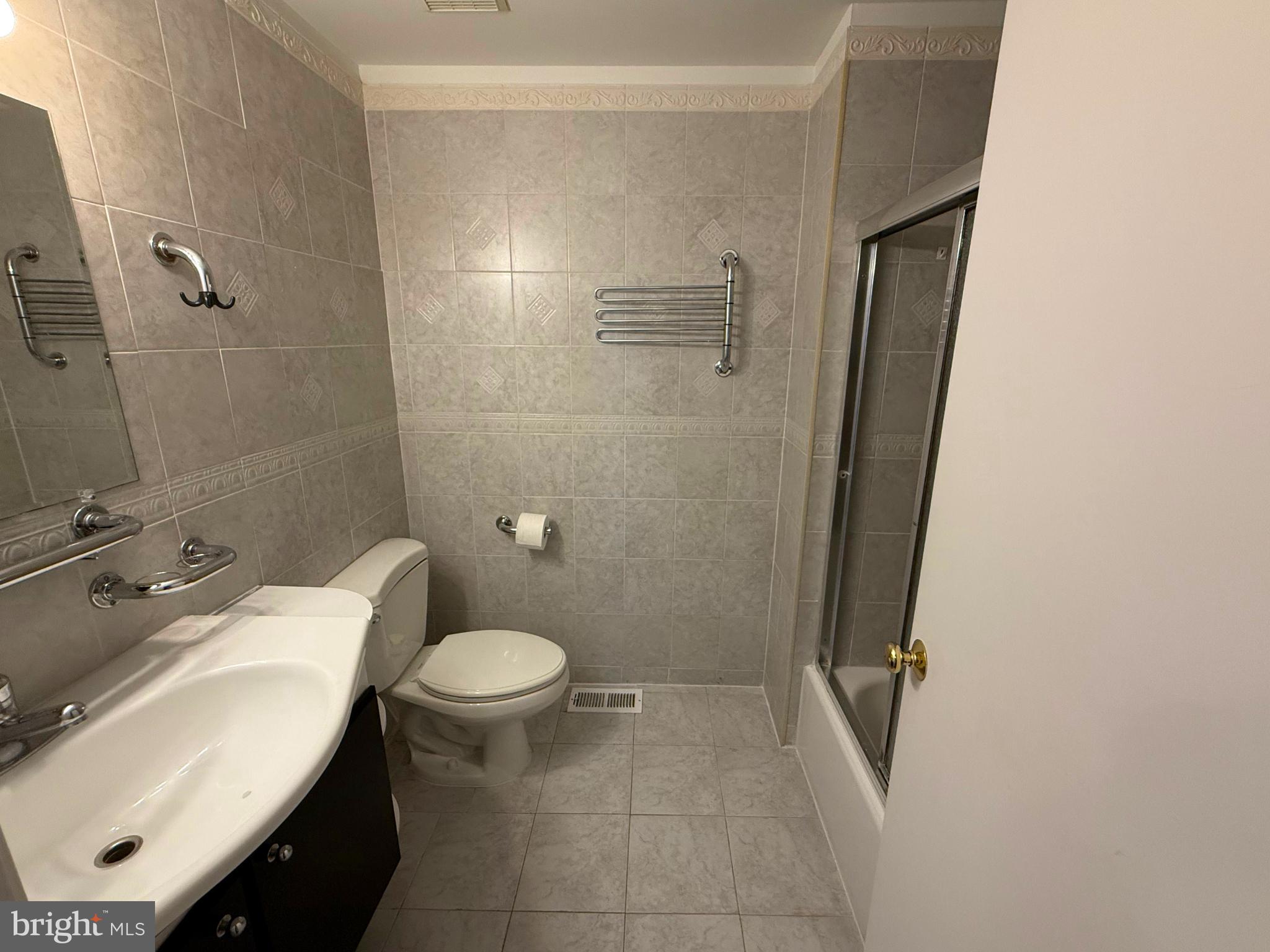 5 Coliston Road, Unit C Reisterstown, MD 21136 - Photo 26 of 39 a bathroom with a sink toilet and shower