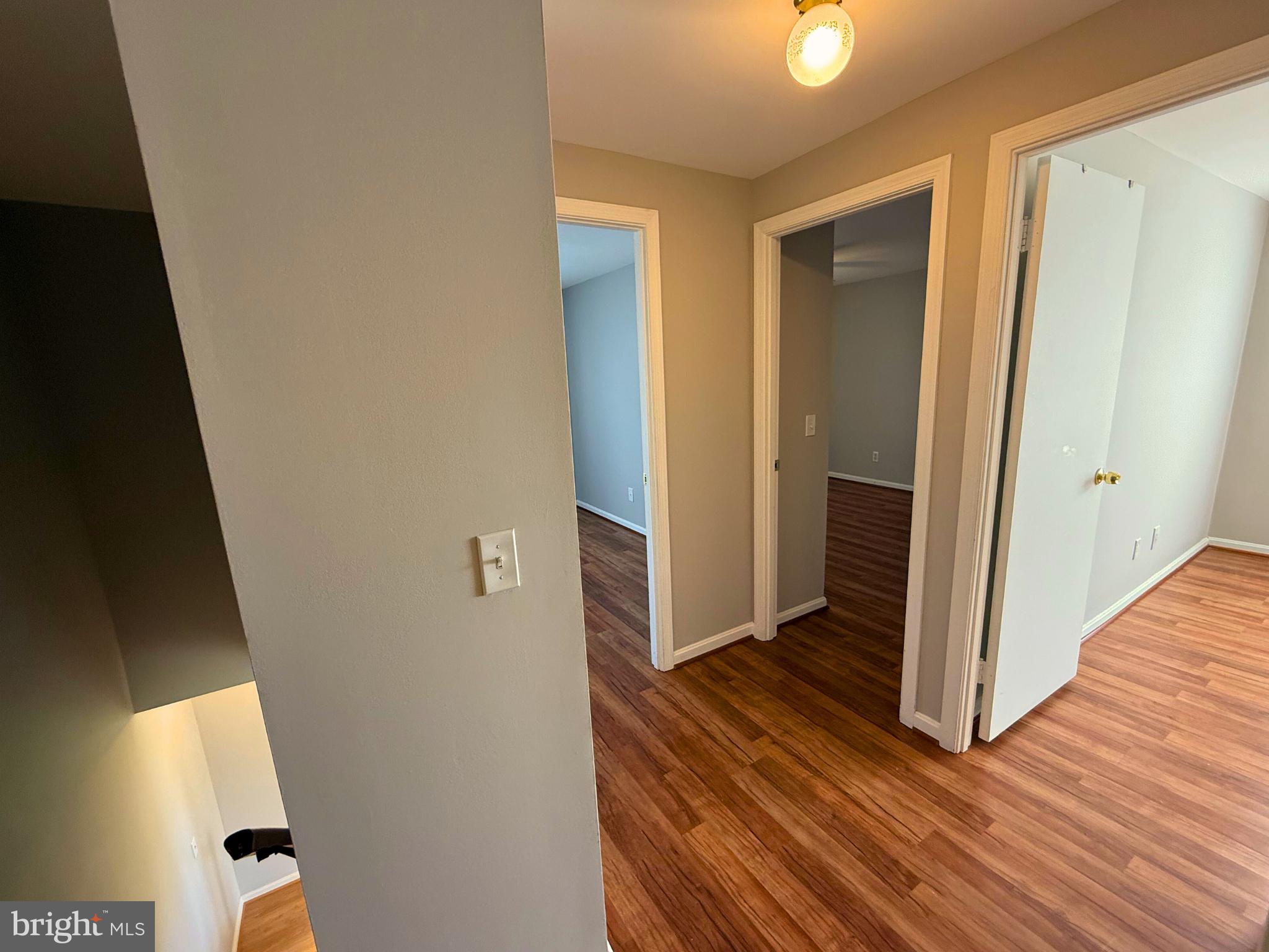 5 Coliston Road, Unit C Reisterstown, MD 21136 - Photo 28 of 39 a view of a hallway with wooden floor and closet