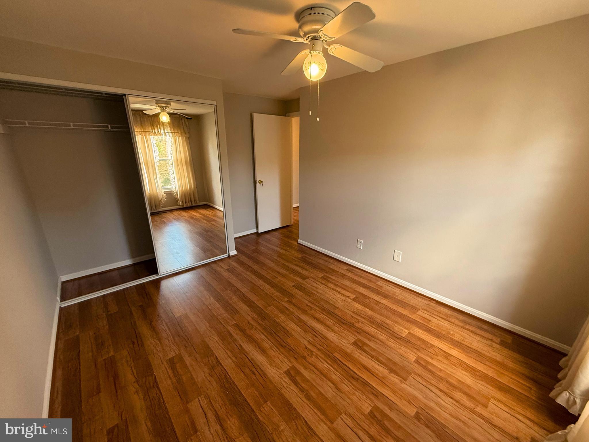5 Coliston Road, Unit C Reisterstown, MD 21136 - Photo 33 of 39 wooden floor in an empty room with a window