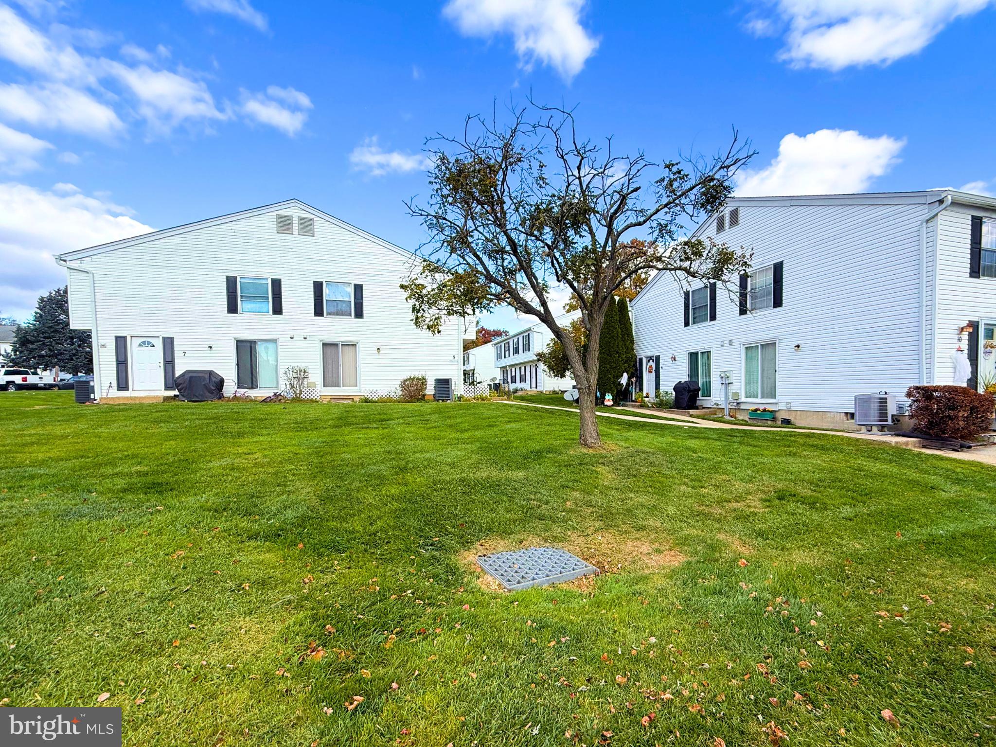 5 Coliston Road, Unit C Reisterstown, MD 21136 - Photo 5 of 39 a front view of house with yard and trees
