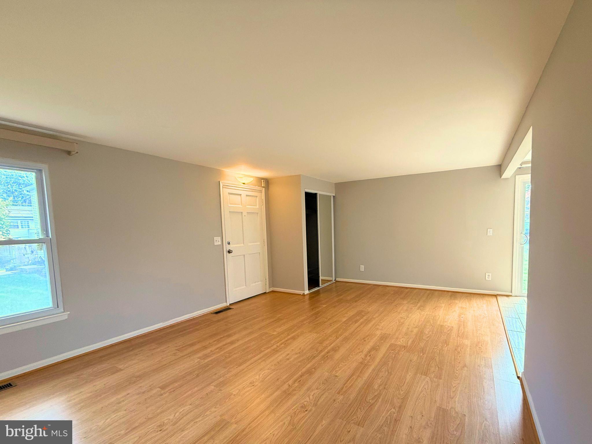 5 Coliston Road, Unit C Reisterstown, MD 21136 - Photo 10 of 39 a view of an empty room with wooden floor and a window