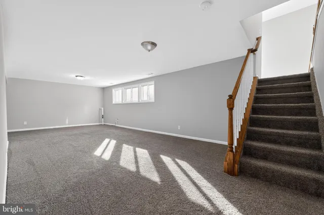 a view of an empty room with stairs
