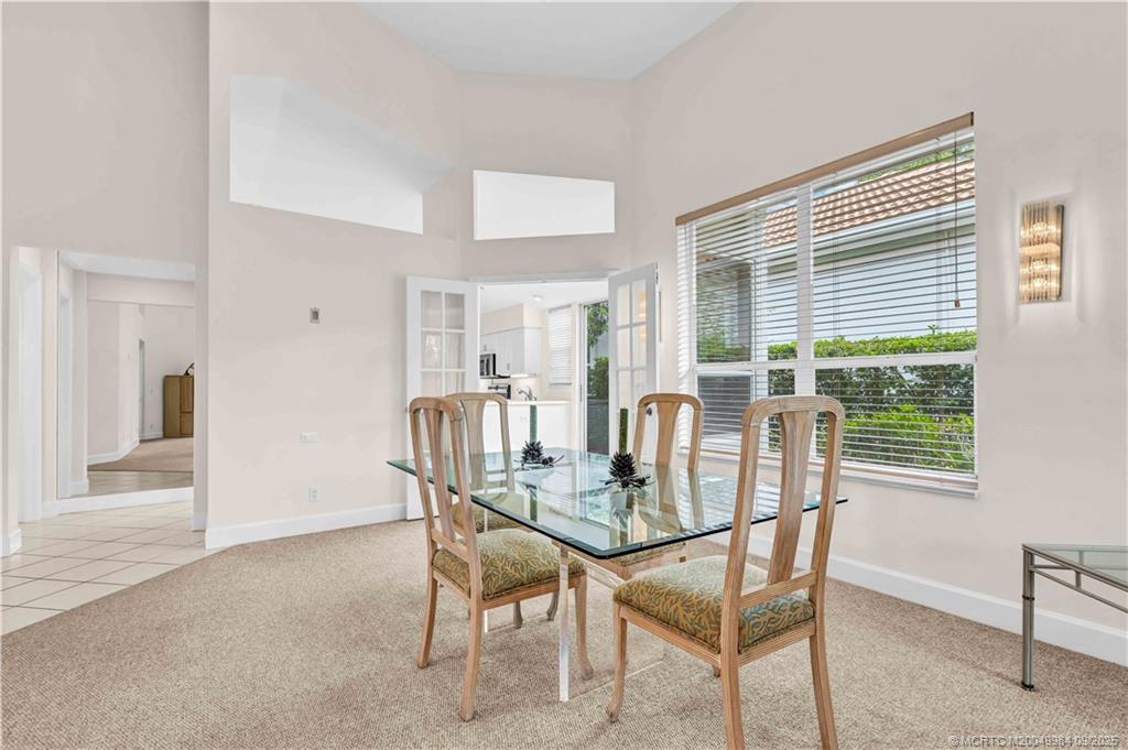 13005 Harbour Ridge Boulevard Palm City, FL 34990 - Photo 11 of 40 a dining room with furniture and window