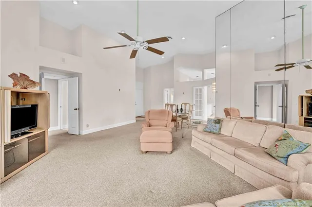 a bedroom with a bed and painting on the wall