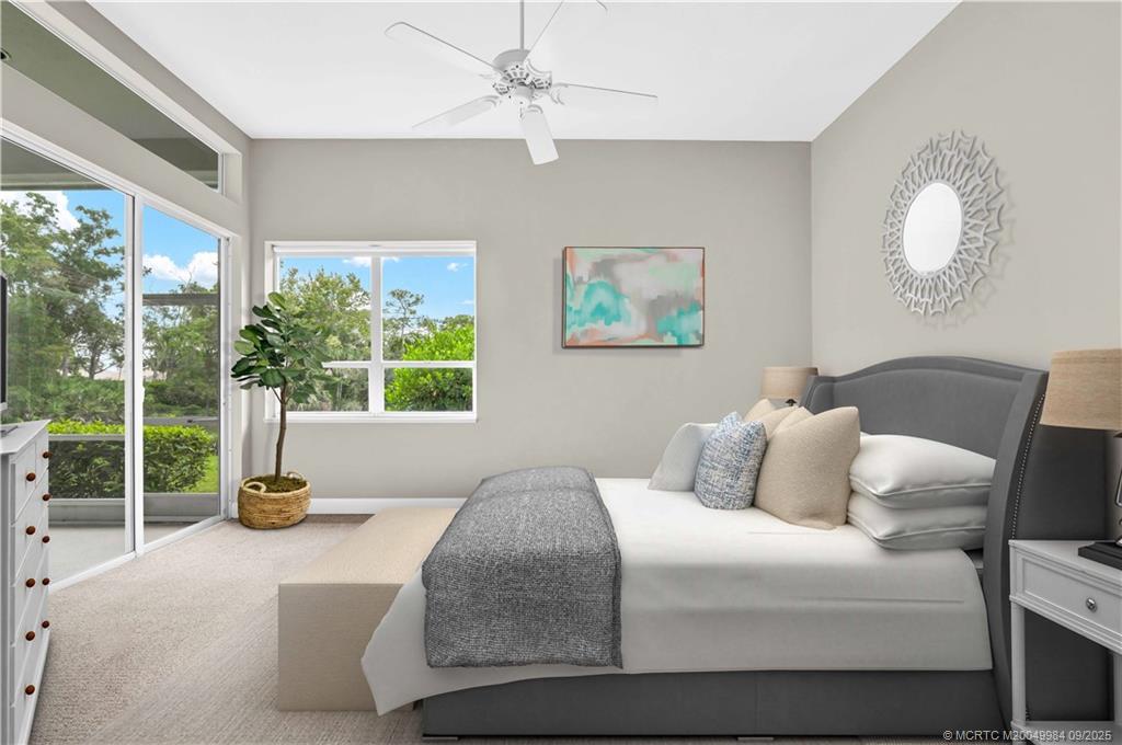 13005 Harbour Ridge Boulevard Palm City, FL 34990 - Photo 15 of 40 a bedroom with a bed and painting on the wall