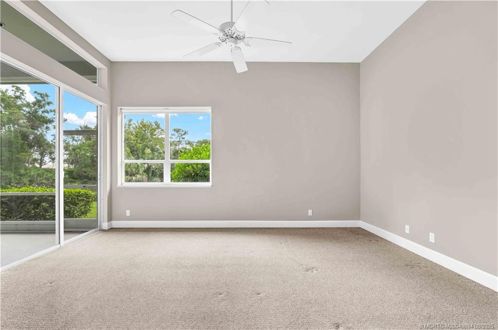 13005 Harbour Ridge Boulevard Palm City, FL 34990 - Photo 16 of 40 an empty room with a window