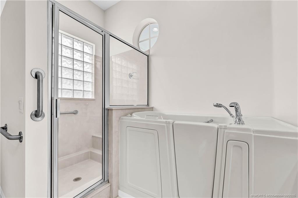 13005 Harbour Ridge Boulevard Palm City, FL 34990 - Photo 19 of 40 a bathroom with a shower