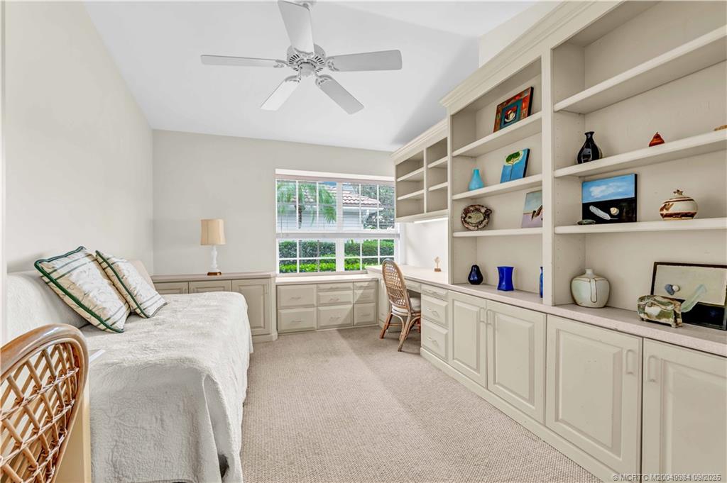 13005 Harbour Ridge Boulevard Palm City, FL 34990 - Photo 20 of 40 a bedroom with bed and a window