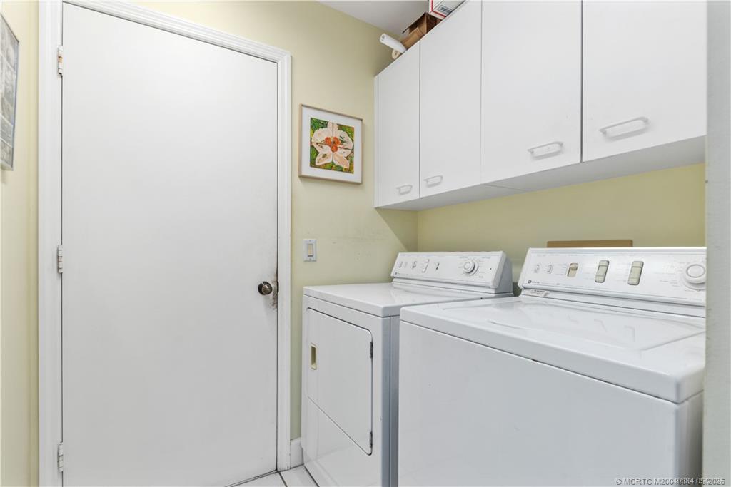 13005 Harbour Ridge Boulevard Palm City, FL 34990 - Photo 23 of 40 a utility room with dryer and washer