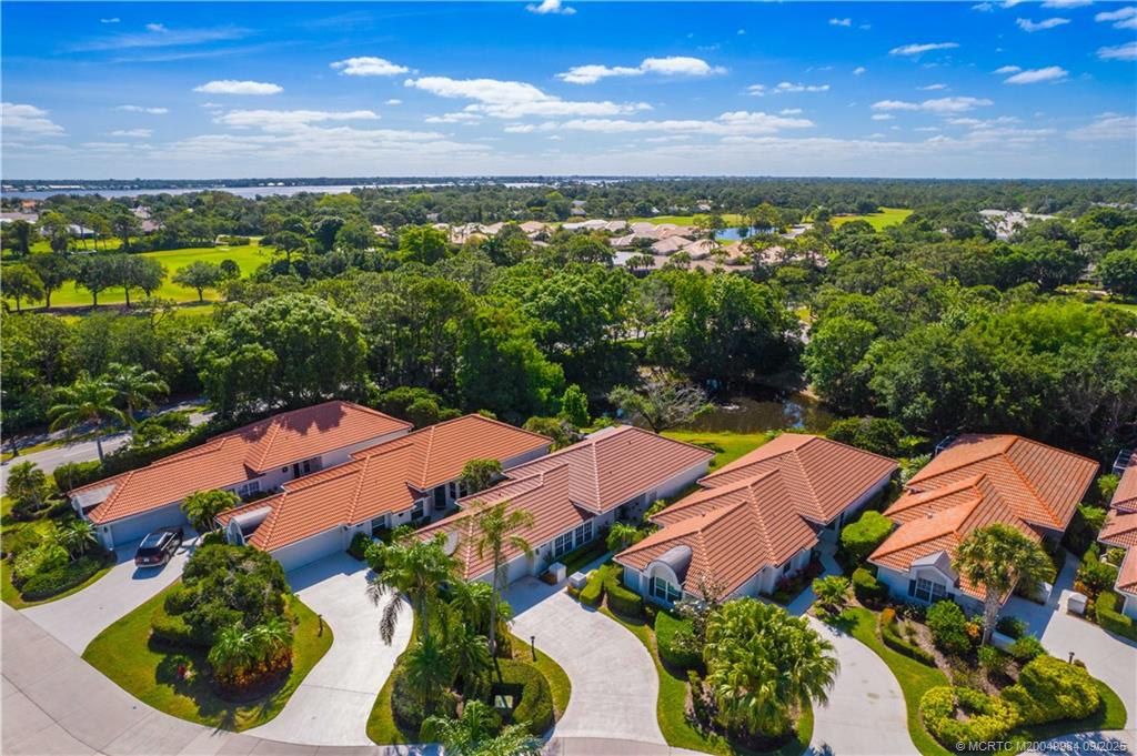13005 Harbour Ridge Boulevard Palm City, FL 34990 - Photo 29 of 40 an aerial view of residential houses with outdoor space and trees