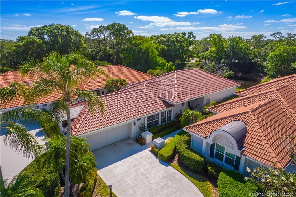 13005 Harbour Ridge Boulevard Palm City, FL 34990 - Photo 30 of 40 a view of a house with a yard