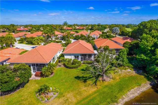 an aerial view of residential building and ocean
