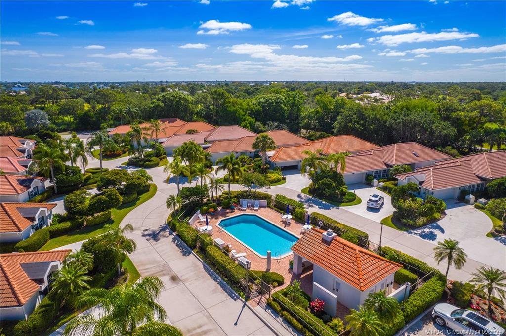 13005 Harbour Ridge Boulevard Palm City, FL 34990 - Photo 40 of 40 an aerial view of multiple houses with yard