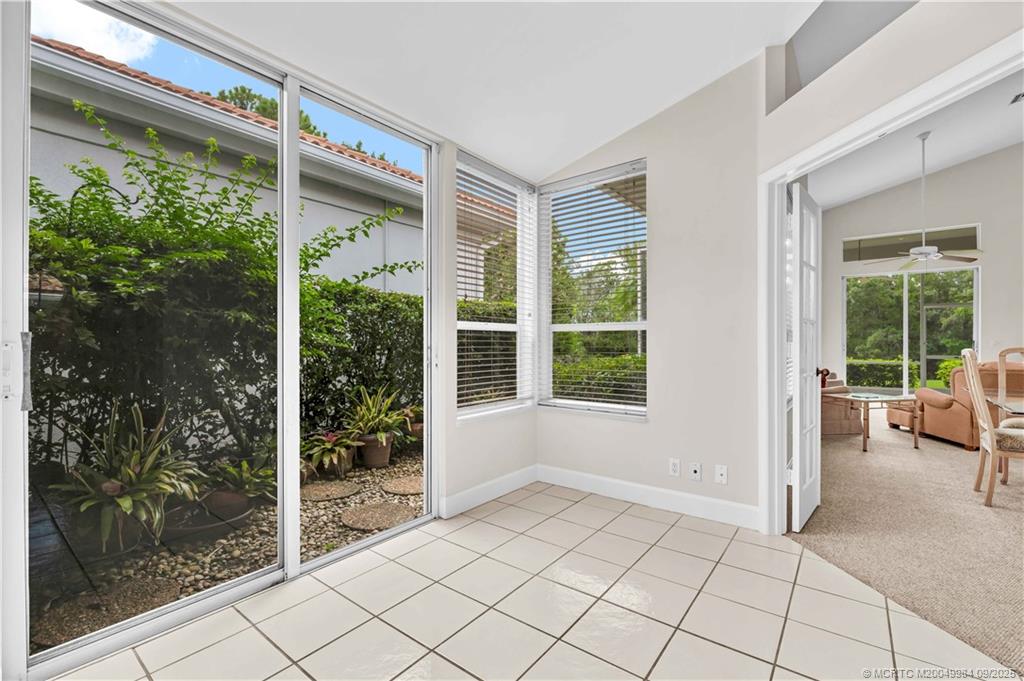 13005 Harbour Ridge Boulevard Palm City, FL 34990 - Photo 8 of 40 a view of an empty room and window