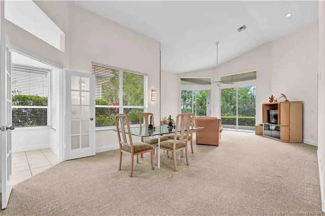 a dining room with furniture and window