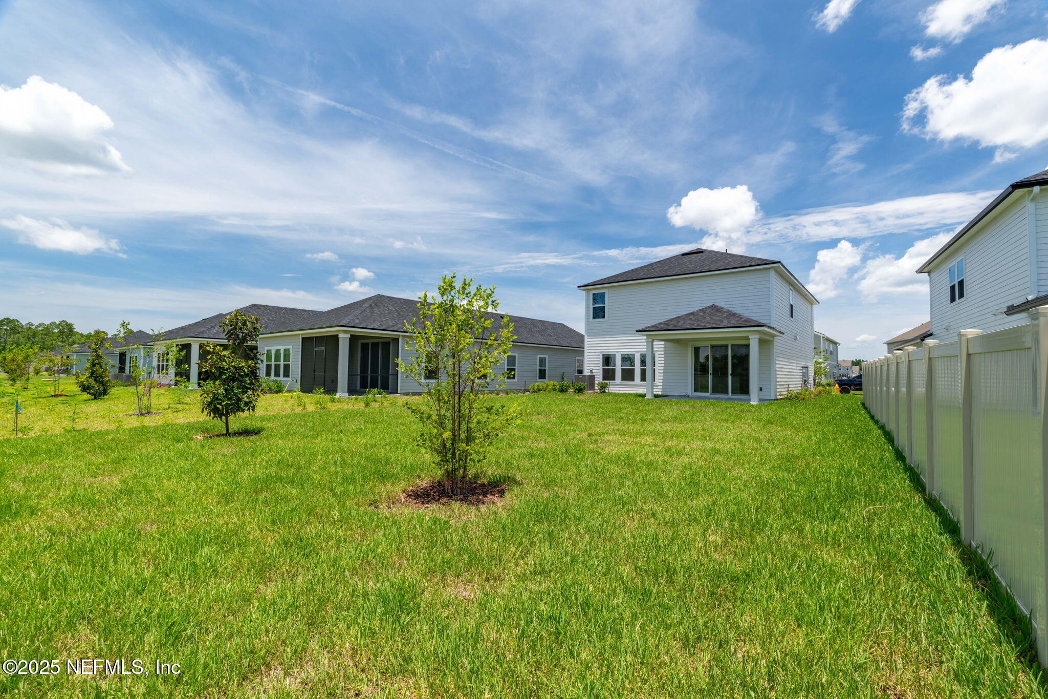386 Whirlwind Place St. Augustine, FL 32095 - Photo 32 of 41 a front view of a house with a yard