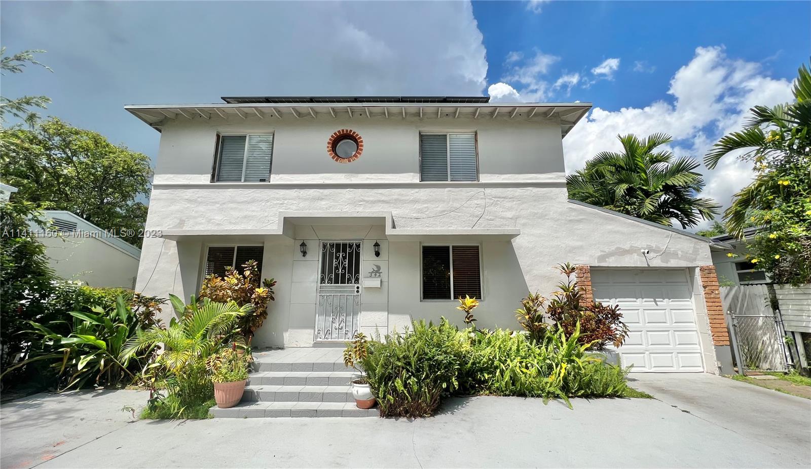 342 Southwest 29th Road Miami, FL 33129 - Photo 1 of 28 a front view of a house with plants