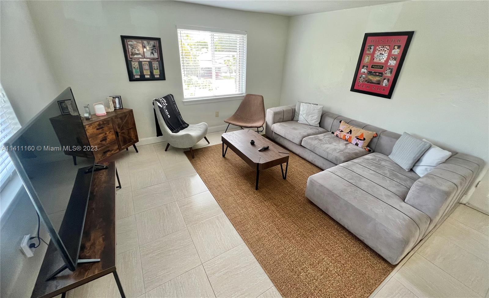 342 Southwest 29th Road Miami, FL 33129 - Photo 15 of 28 a living room with furniture and a window