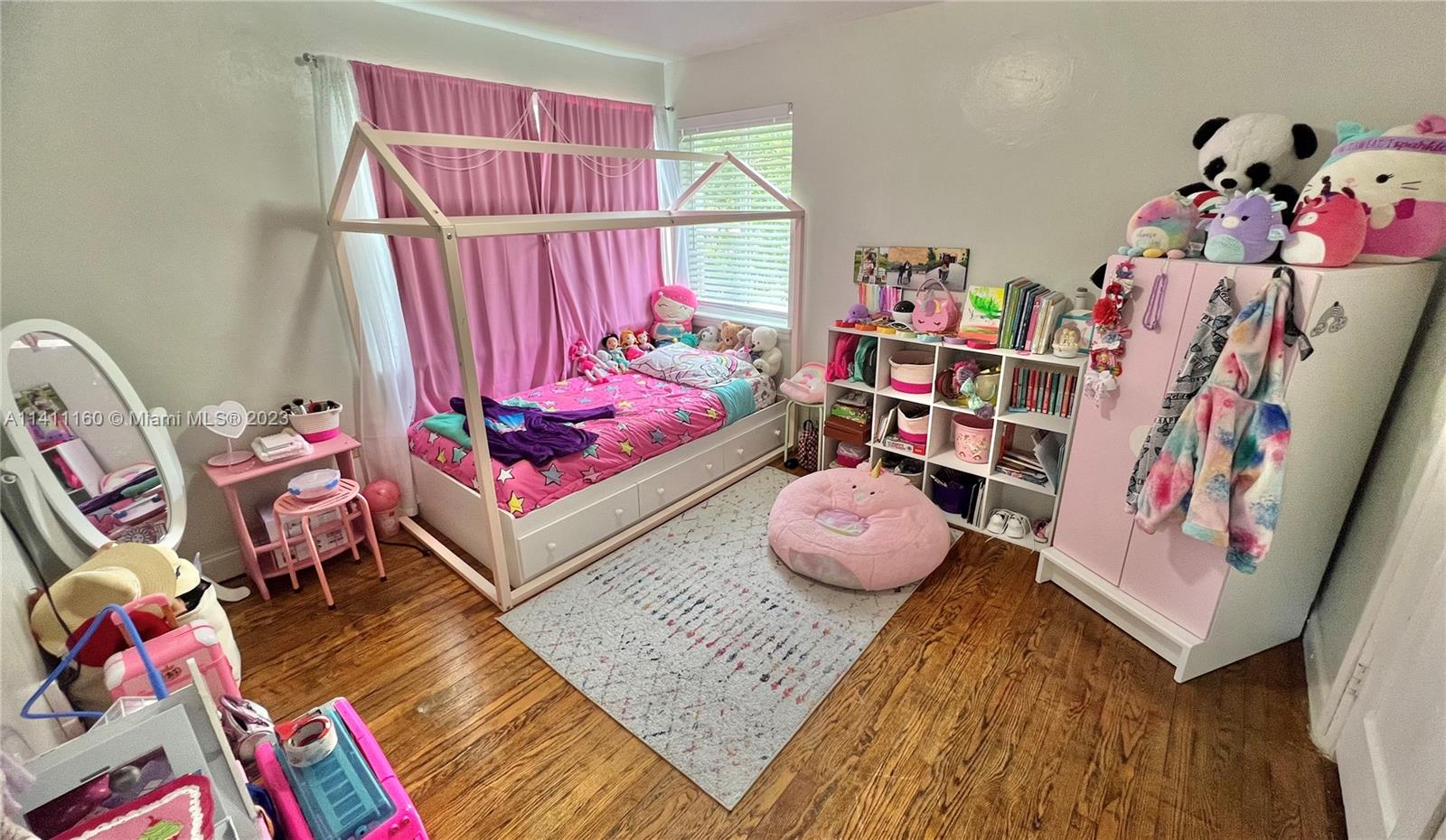 342 Southwest 29th Road Miami, FL 33129 - Photo 19 of 28 a bedroom with baby toys and pink rug