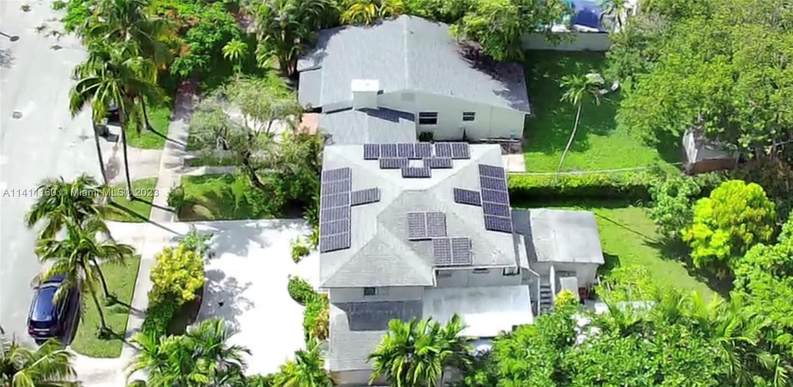 342 Southwest 29th Road Miami, FL 33129 - Photo 5 of 28 an aerial view of a house with swimming pool garden and patio