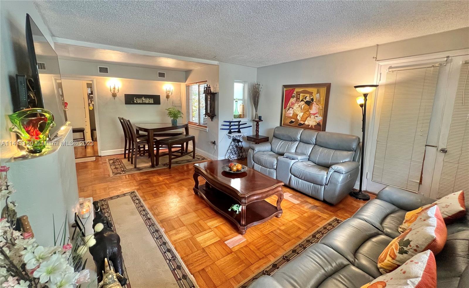 342 Southwest 29th Road Miami, FL 33129 - Photo 7 of 28 a living room with furniture and a flat screen tv