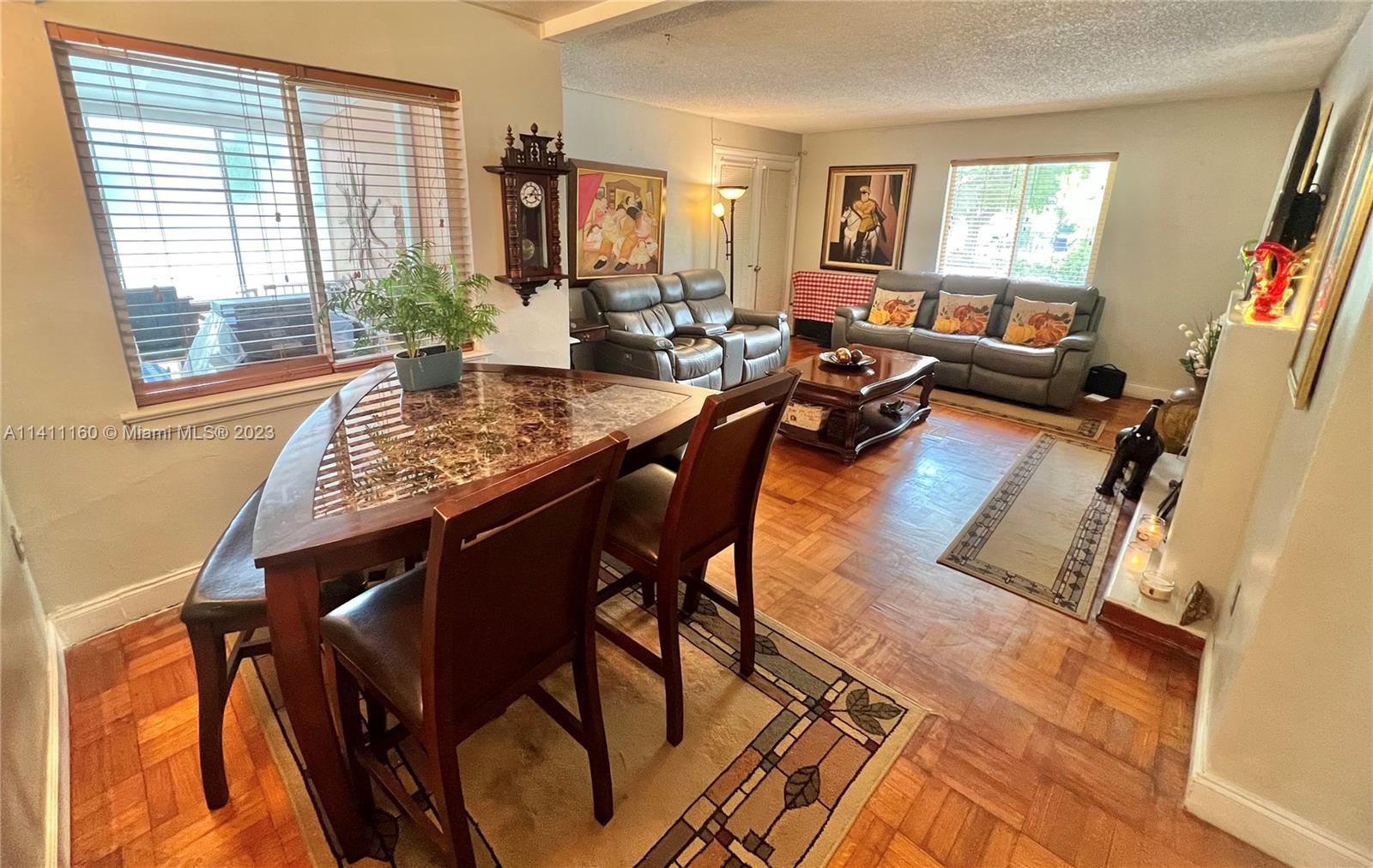 342 Southwest 29th Road Miami, FL 33129 - Photo 8 of 28 a living room with furniture and wooden floor