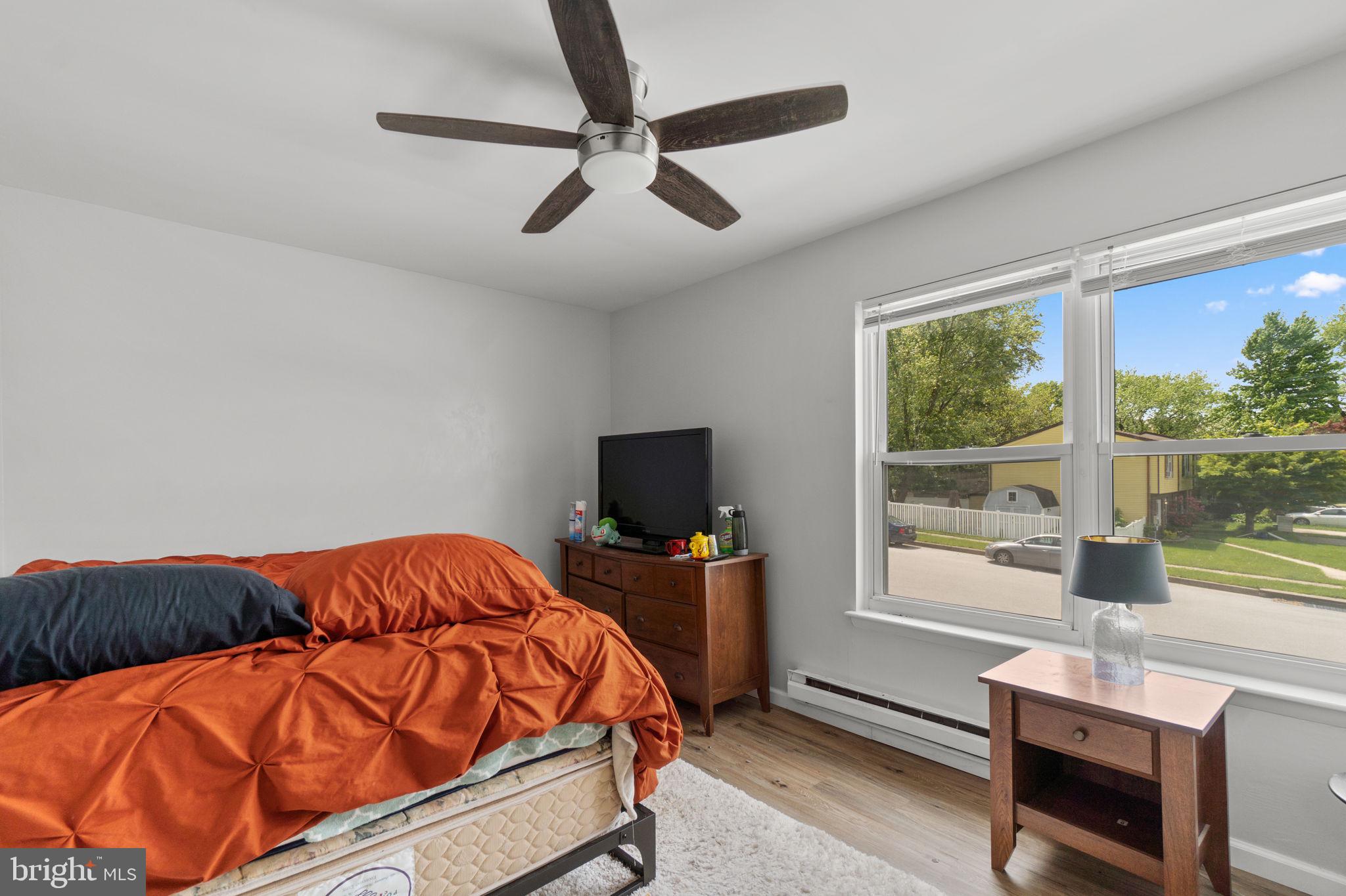 313 Janice Way Westminster, MD 21158 - Photo 12 of 23 a bedroom with a bed and glass window