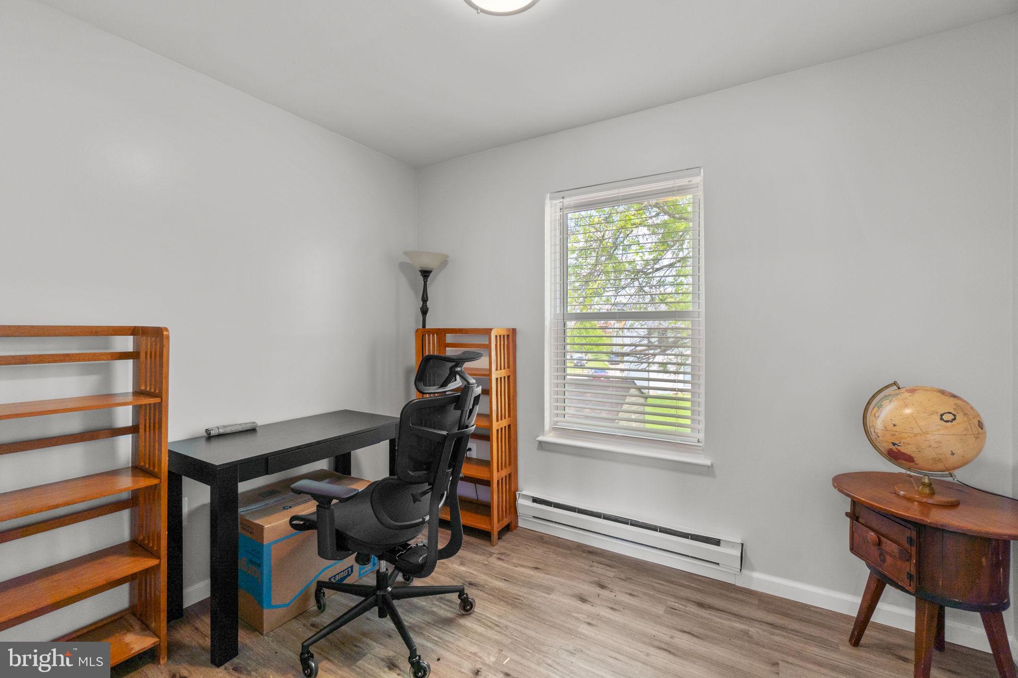 313 Janice Way Westminster, MD 21158 - Photo 17 of 23 a view of a workspace with furniture and a window