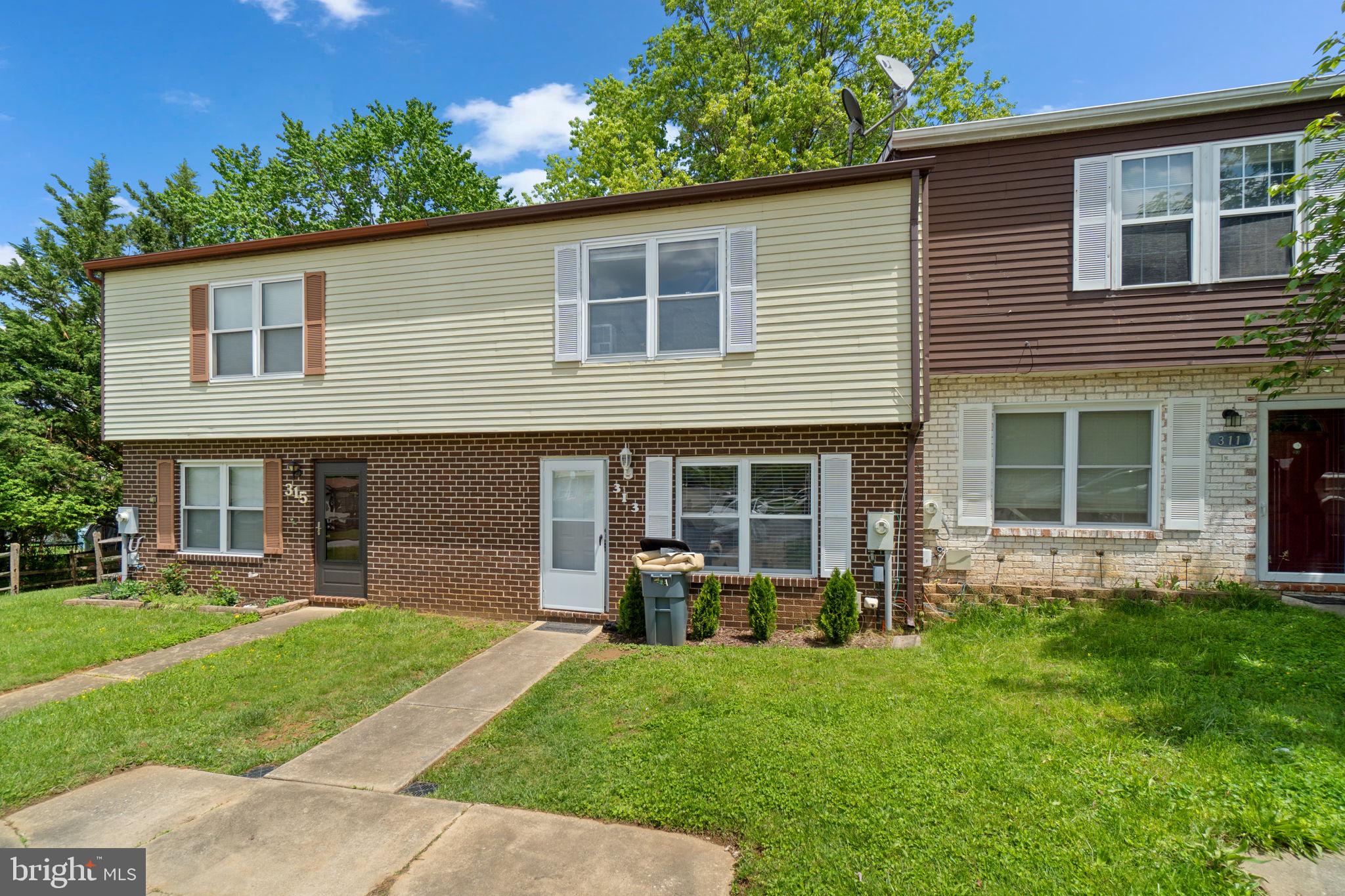 313 Janice Way Westminster, MD 21158 - Photo 23 of 23 a view of a house with a yard and a large tree