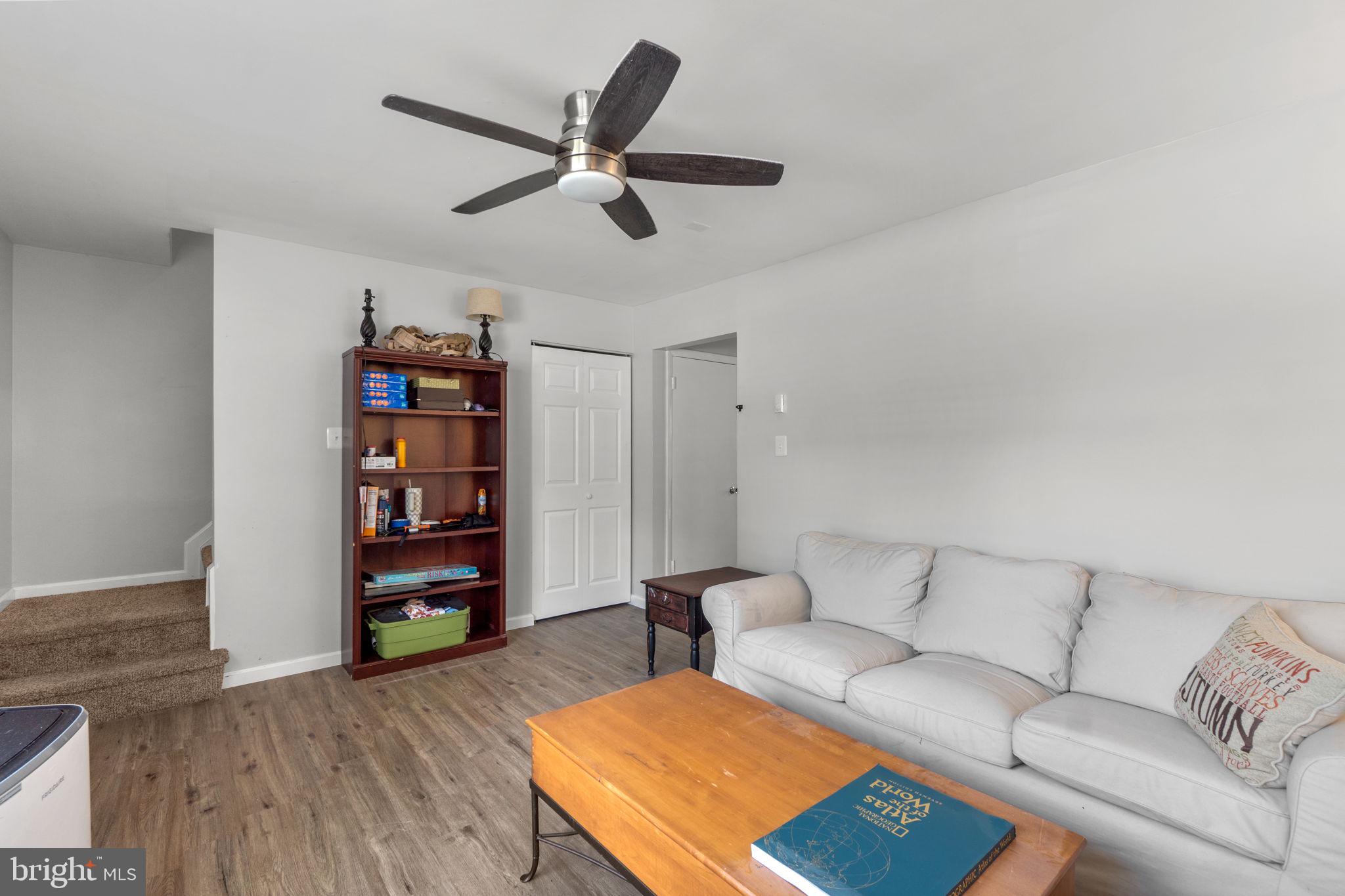 313 Janice Way Westminster, MD 21158 - Photo 5 of 23 a living room with furniture and a book shelf