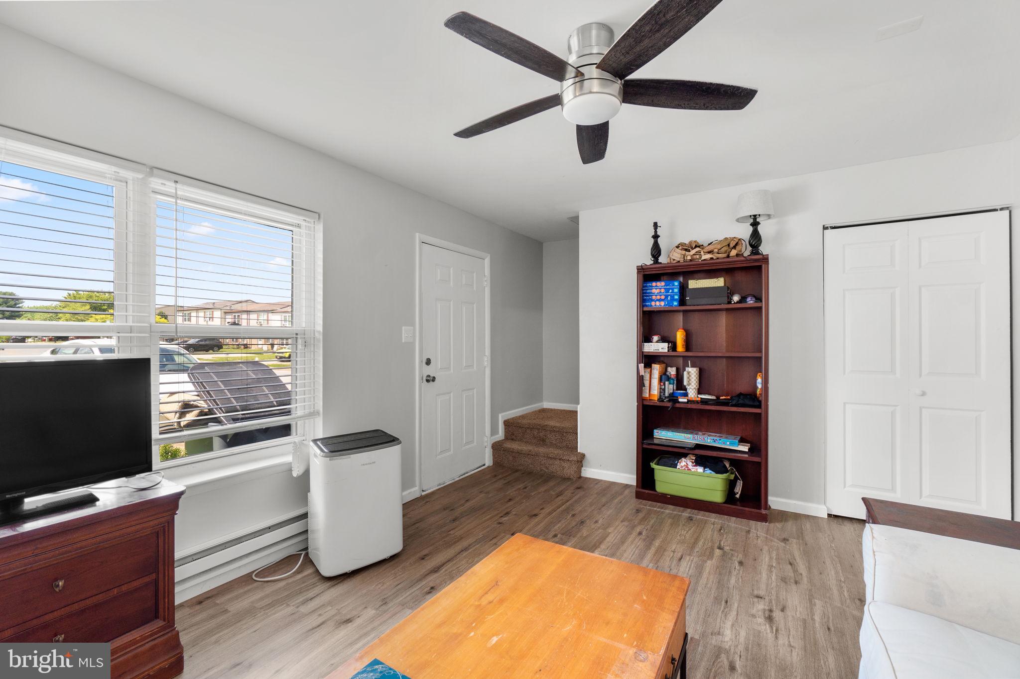 313 Janice Way Westminster, MD 21158 - Photo 6 of 23 a living room with furniture and a flat screen tv