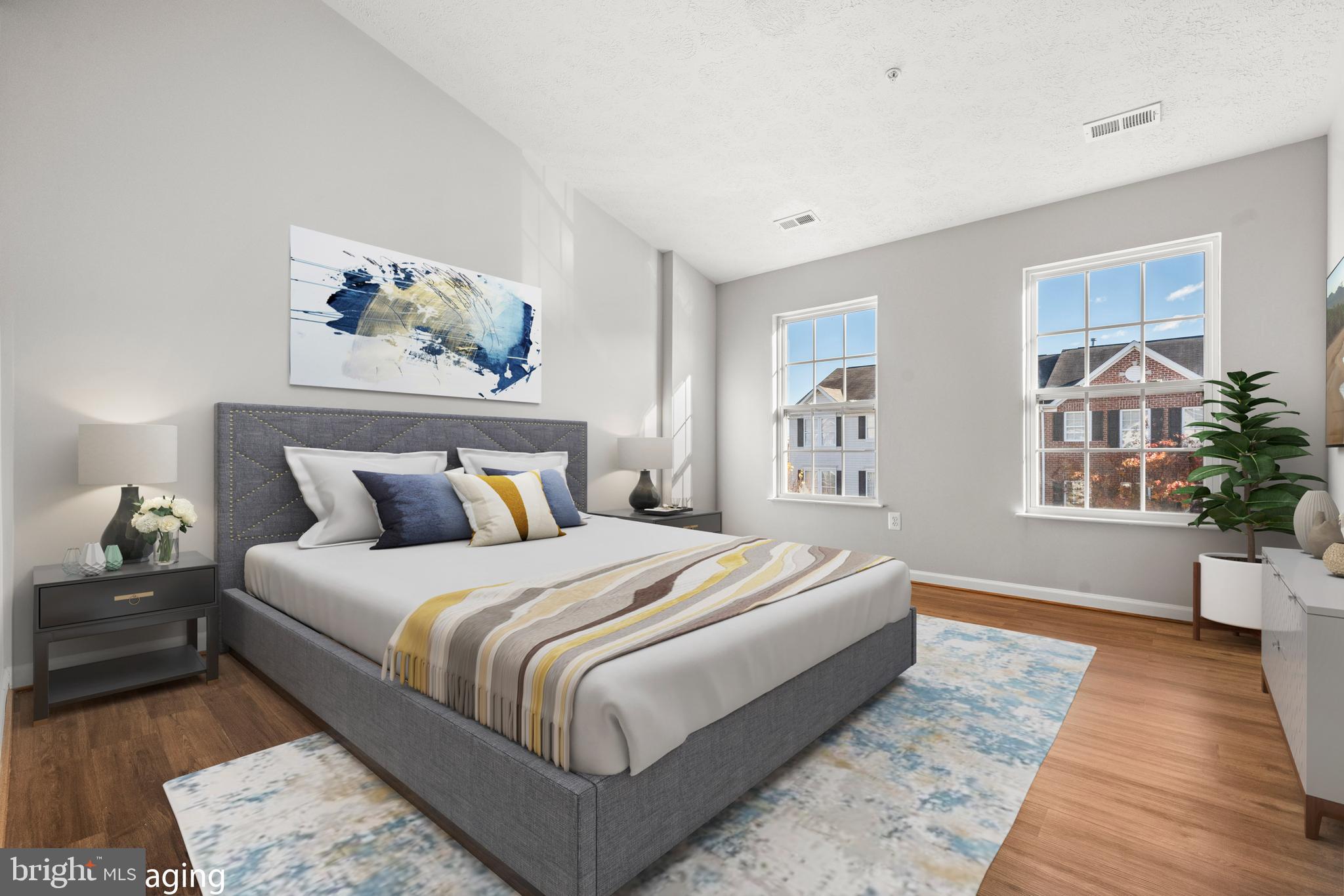 826 Lowe Road Baltimore, MD 21220 - Photo 11 of 35 a bedroom with bed and wooden floor