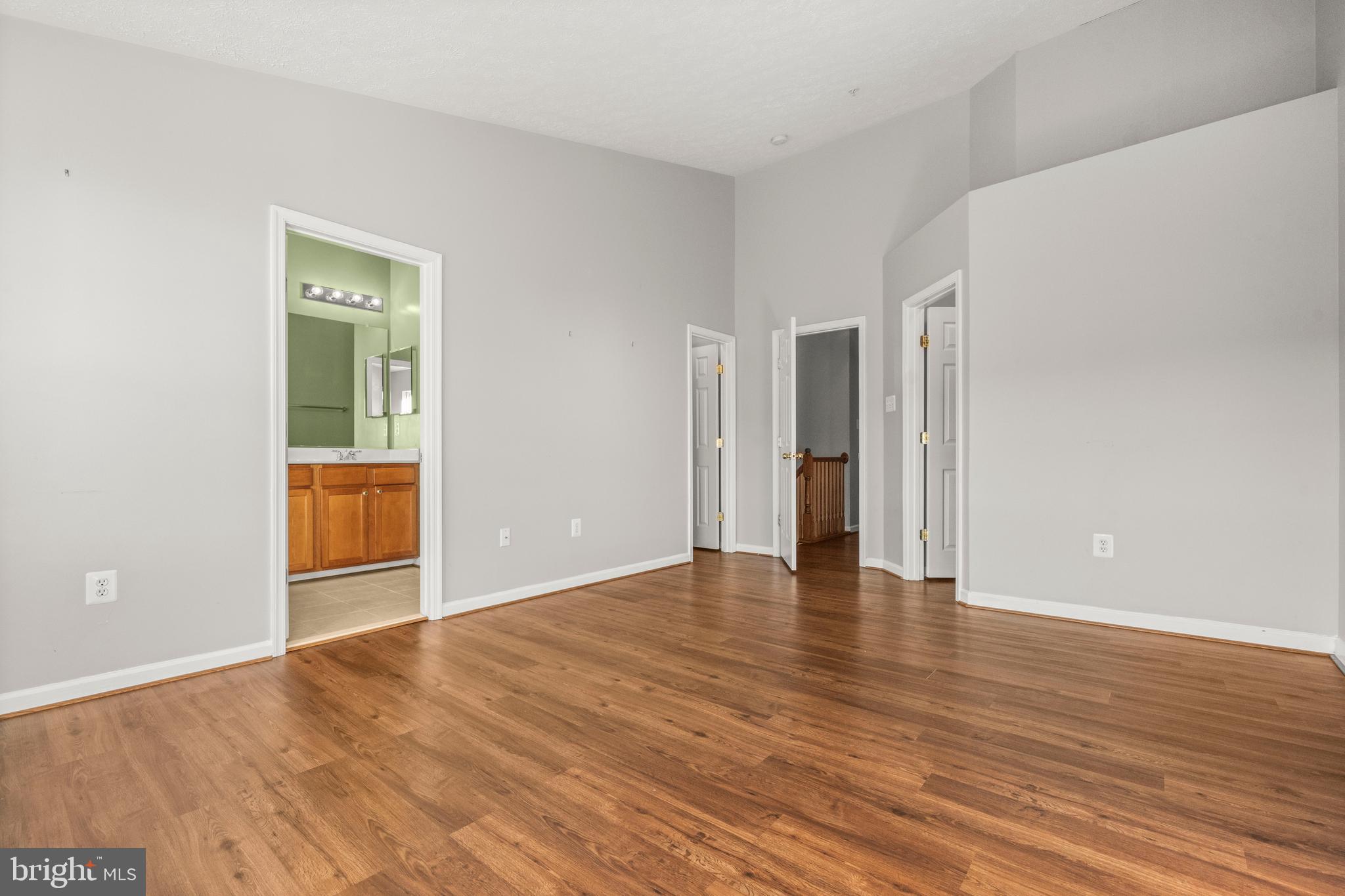 826 Lowe Road Baltimore, MD 21220 - Photo 15 of 35 a view of an empty room with wooden floor and closet