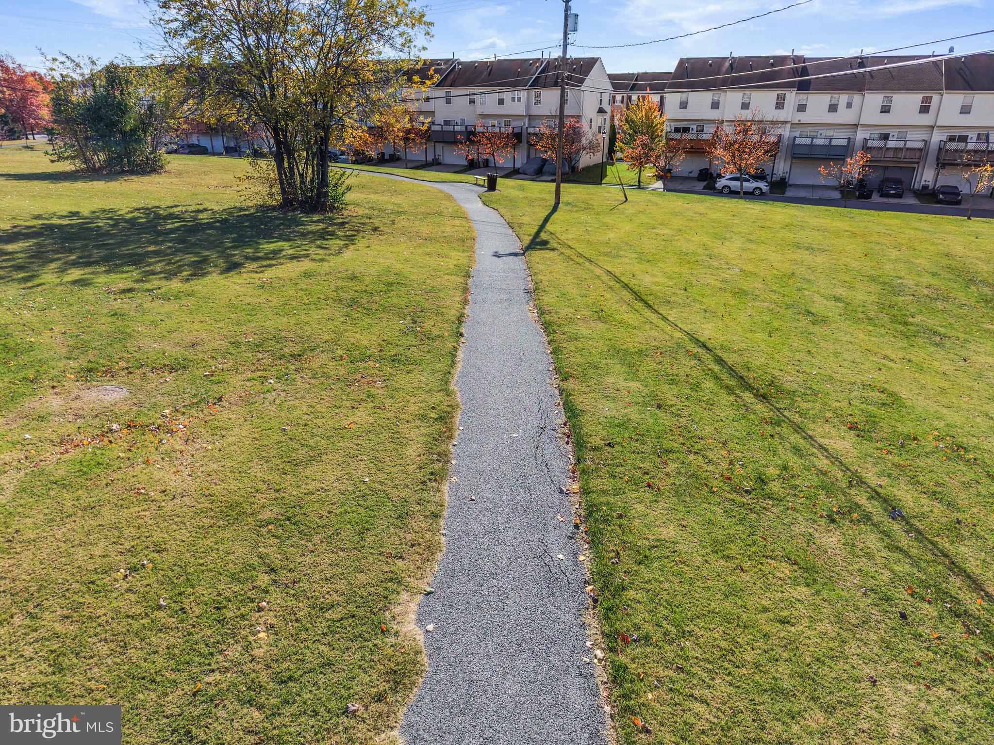 826 Lowe Road Baltimore, MD 21220 - Photo 30 of 35 a view of a swimming pool with lawn chairs and a yard