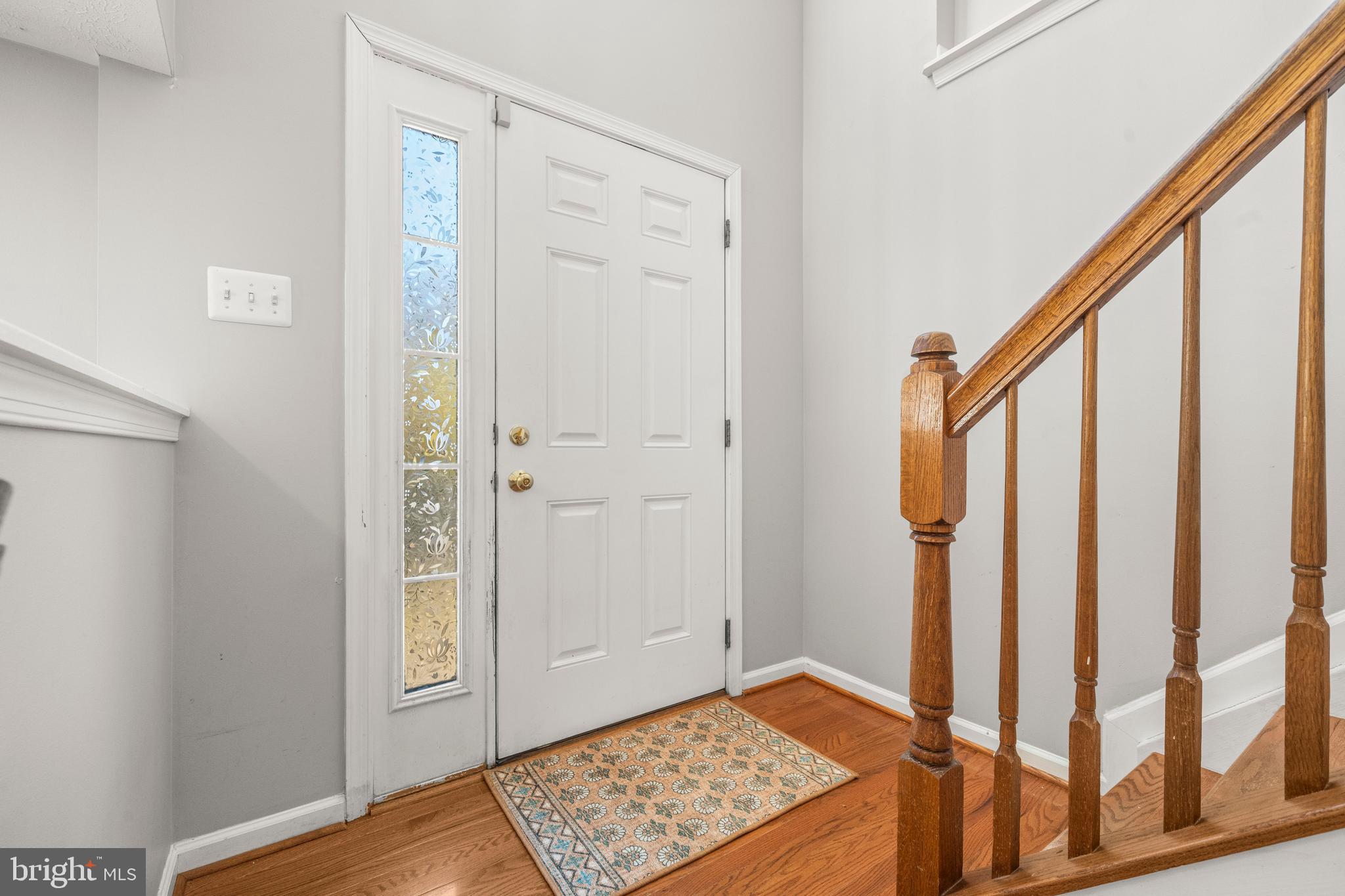 826 Lowe Road Baltimore, MD 21220 - Photo 3 of 35 a view of front door with wooden floor