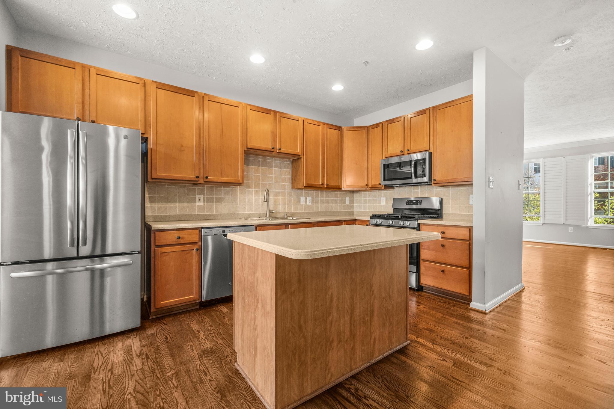 826 Lowe Road Baltimore, MD 21220 - Photo 7 of 35 a kitchen with stainless steel appliances granite countertop a refrigerator stove and a sink