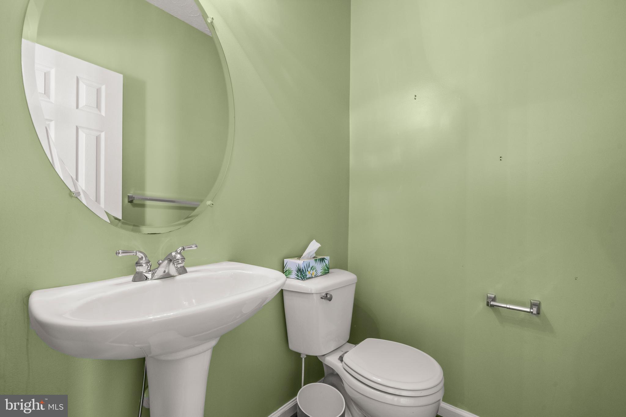 826 Lowe Road Baltimore, MD 21220 - Photo 10 of 35 a bathroom with a sink and a toilet