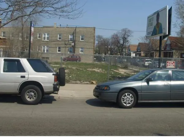 a view of a car parked in front of a building