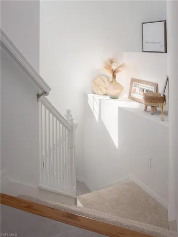 a view of a hallway with stairs