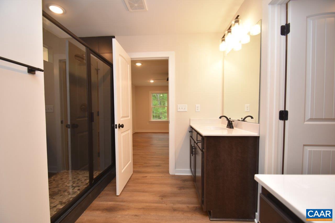 1045 Chopping Road, Unit CP 1 Mineral, VA 23117 - Photo 20 of 27 a bathroom with a sink and mirror