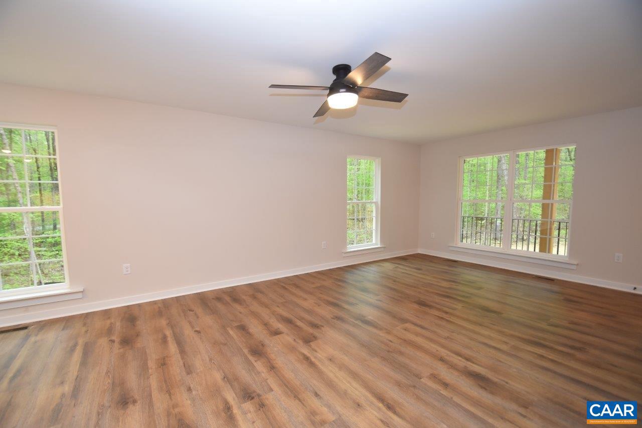 1045 Chopping Road, Unit CP 1 Mineral, VA 23117 - Photo 7 of 27 a view of an empty room with wooden floor and a window