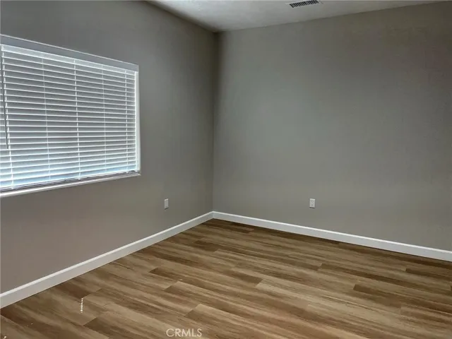 a view of bathroom and a hallway